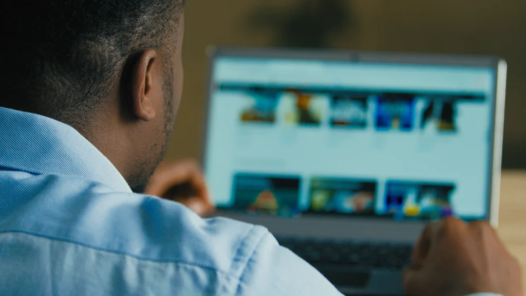 Generative Engine Optimisation South Africa (Man browsing detailed content on a website)