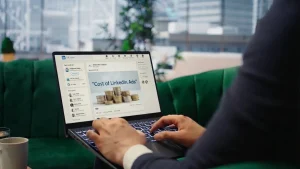 LinkedIn Ads Cost in South Africa (2026) (Person viewing a LinkedIn ad on their laptop)