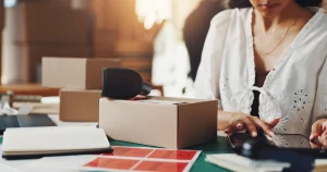 Google Shopping in South Africa 2026: Store Guide (Woman packing product orders for her online business)