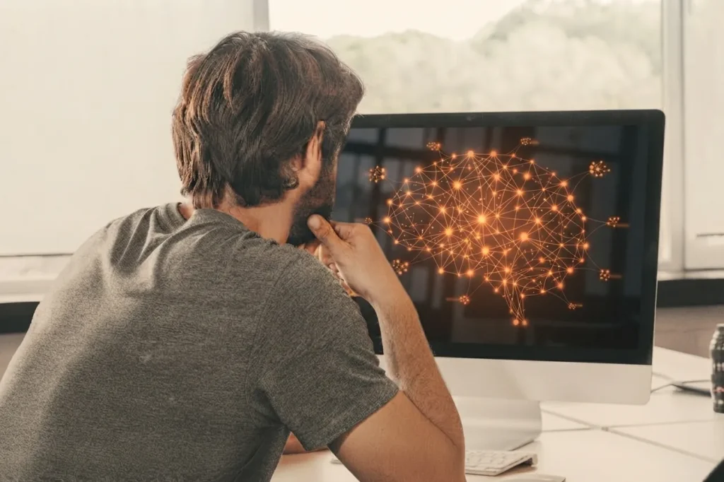 AI for Marketing Agencies: A Knowledge Base (A man working at his PC on an AI knowledge base)