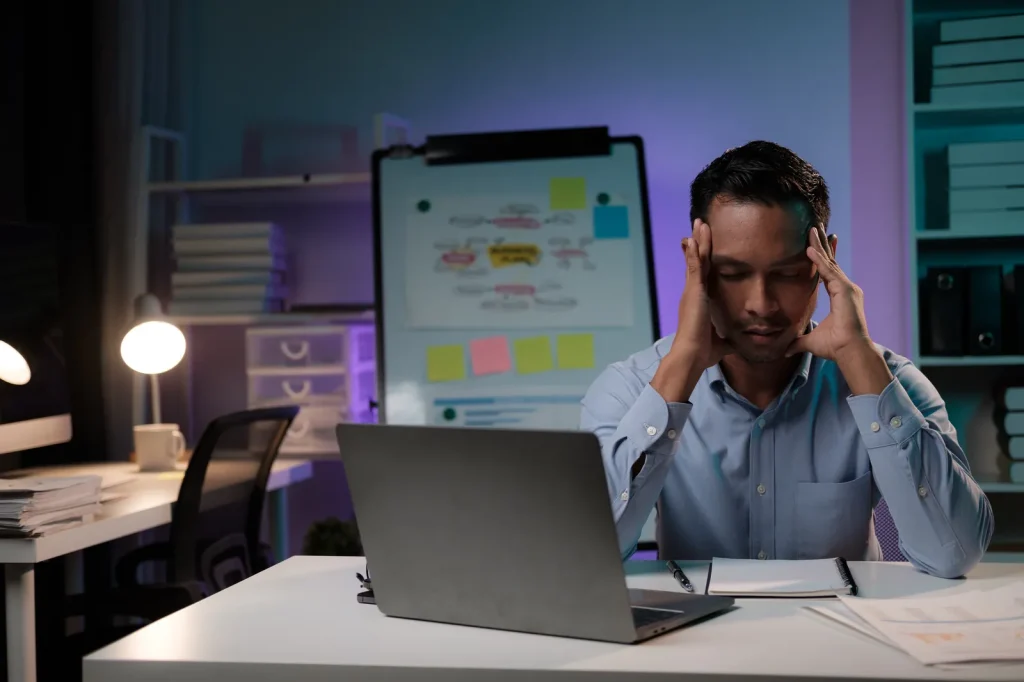 Why Are My Ads Not Working? SA (2026) (A man sitting at his laptop looking tired and irritated)